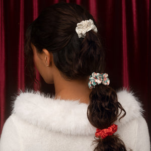 KITSCH Holiday Ruched Satin Scrunchies 7pc Set — back view of a model with scrunchies spaced down a low ponytail — Designed for all-day use or overnight wear — festive bubble ponytails