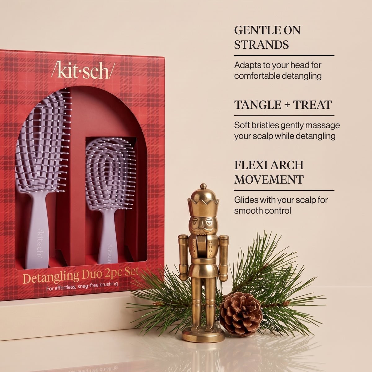 KITSCH Soft Violet Detangling Duo 2pc Set — infographic of the red plaid retail box with the soft violet full-size and mini flexi brushes beside a brass nutcracker, pine branch and pine cone, with callouts Gentle on Strands, Tangle + Treat and Flexi Arch Movement — Includes full-size and mini brushes for easy detangling at home or on the go — gently detangles wet or dry hair for smoother, more manageable strands