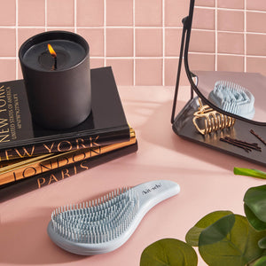 Kitsch Haze Blue Detangling Brush with packaging and a 5-star customer review