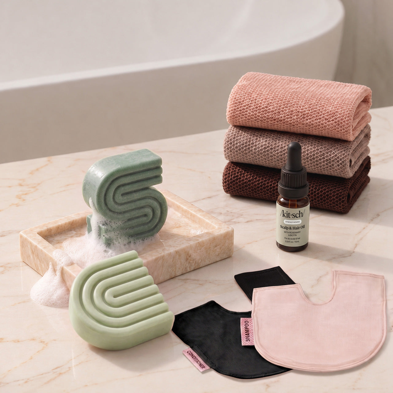 Rosemary & Biotin: Kitsch Winter Welcome Kit with Rosemary & Biotin shampoo and conditioner bars, Rosewood African Net Sponge, shampoo and conditioner bar bags, and Rosemary & Biotin Scalp & Hair Oil.