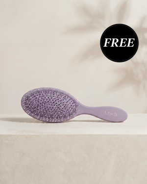 Kitsch Soft Violet Wet/Dry Brush shown with its retail packaging, flexible bristles designed to glide through knots and tangles without pulling hair